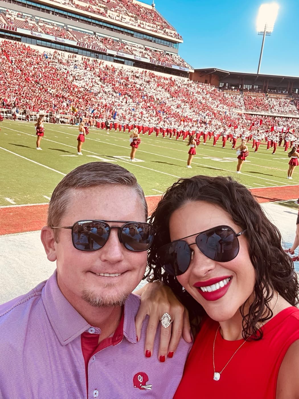 Julie Routzahn at an OU football game with her boyfriend